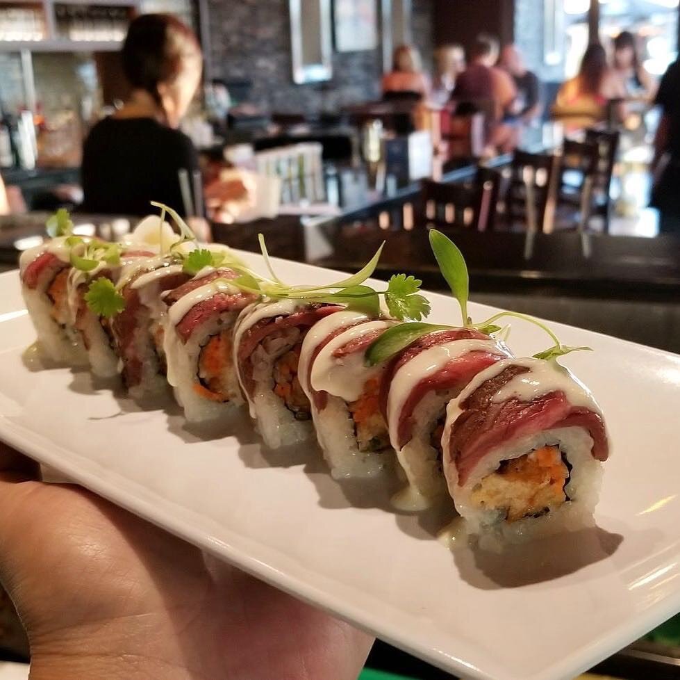 MORA-BB-SushiInServersHands.jpeg